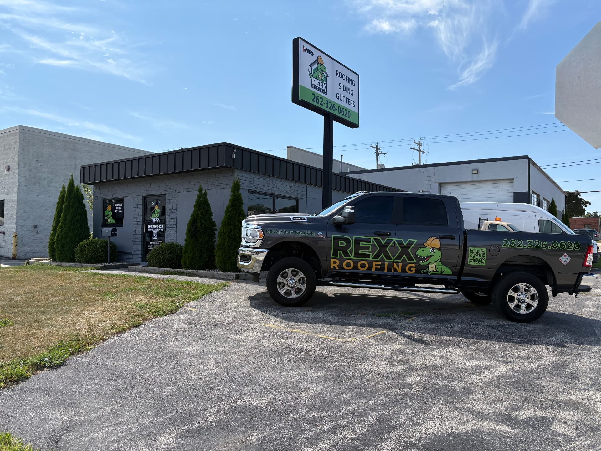 REXX Roofing truck and building — the company Michael helped build before BOLD Brothers